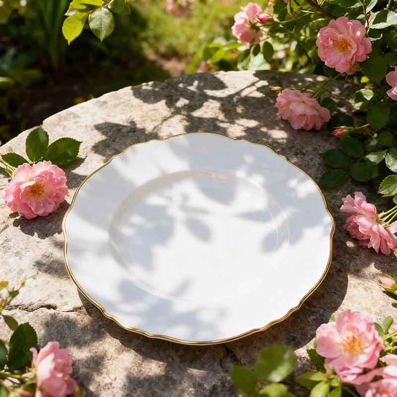 white bone china dinner plate with gilded wavy edge